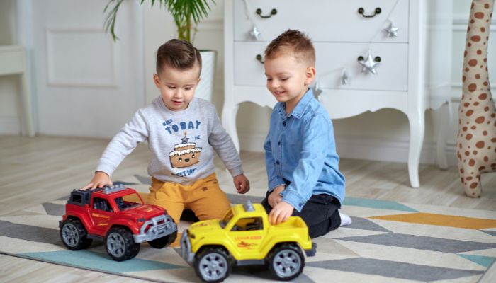 Boys playing with cars